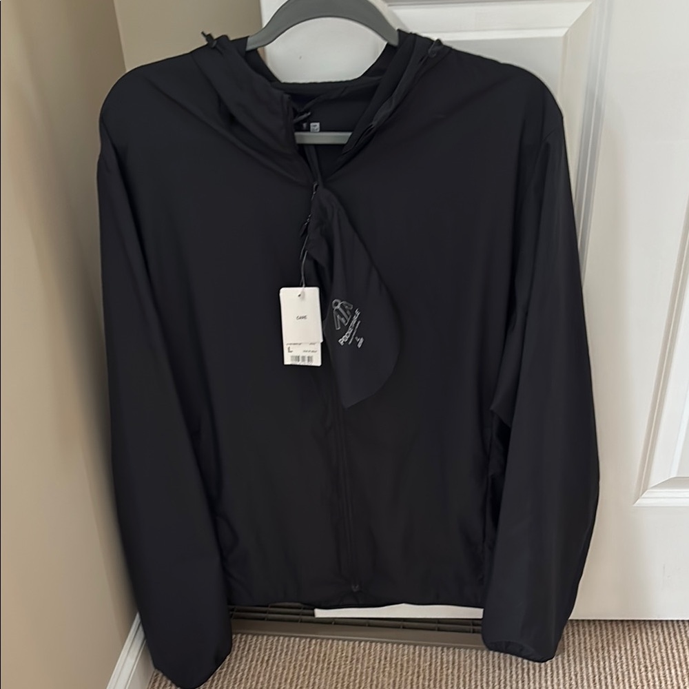 NWT Uniqlo Pocketable Parka, full zip with hood. Men’s Large